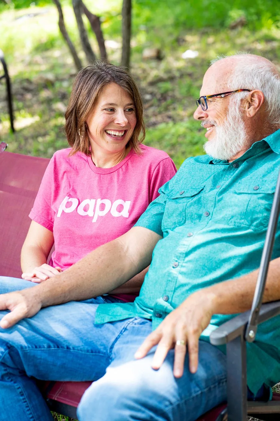 A Papa Pal sharing a laugh with a member outdoors